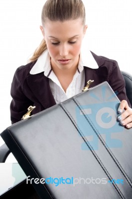 Woman Looking Into Suitcase Stock Photo