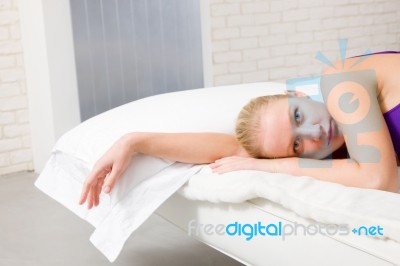 Woman Lying On Bed Stock Photo