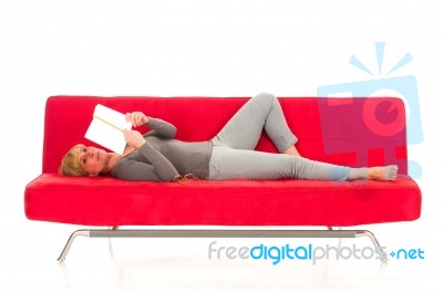 Woman Lying On Sofa Stock Photo