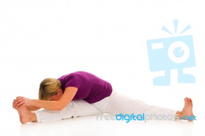 Woman Practicing Stretching Stock Photo