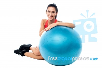 Woman Relaxing With Exercise Ball Stock Photo