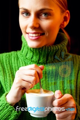 Woman Stirring Coffee Stock Photo