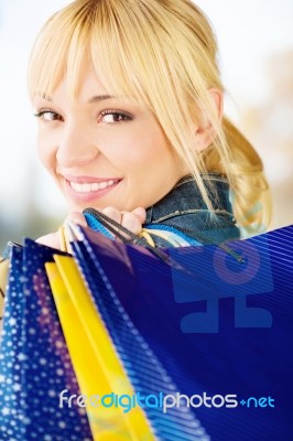 Woman With Bags After Shopping Stock Photo