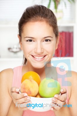 Woman With Bowl Of Fruits Stock Photo