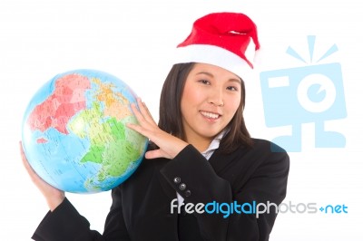 Woman With Santa Hat And Globe Stock Photo