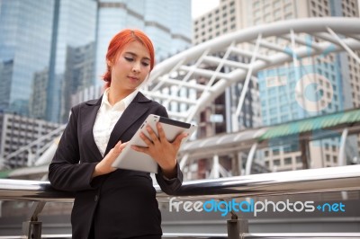 Woman With Tablet At Modern City Stock Photo