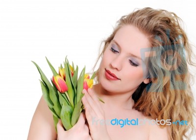 Woman With Tulips Stock Photo