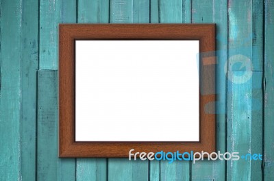 Wood Picture Frame On Green Wall Stock Photo
