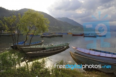  Wooden Boats On The Lake, Nepal Stock Photo