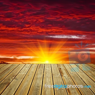 Wooden Deck Floor And Sunset Sky Stock Photo