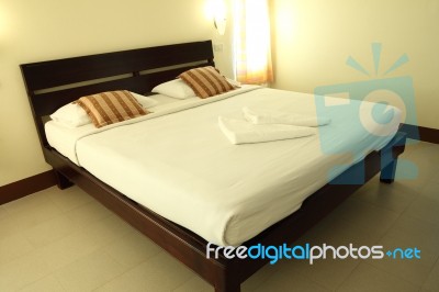 Wooden Frame Bed Stock Photo