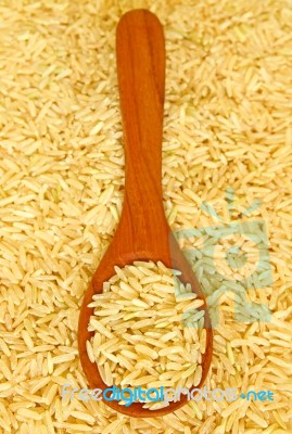 Wooden Ladle On Rice  Stock Photo