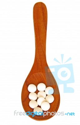 Wooden Spoon With Pills Stock Photo