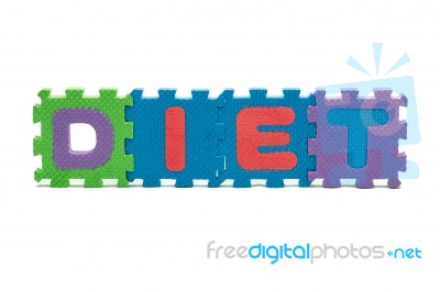 Word Diet Formed With Colorful Foam Puzzle Mat Isolated On White… Stock Photo
