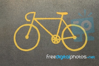 Yellow Bicycle Sign On Track Road Stock Photo