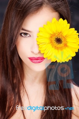 Yellow Daisy Over Woman's Eye Stock Photo