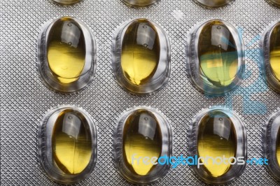 Yellow Oil Pills Stock Photo