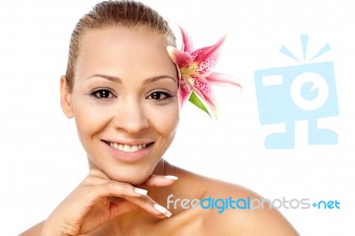Young Beautiful Woman With Pink Flower Stock Photo