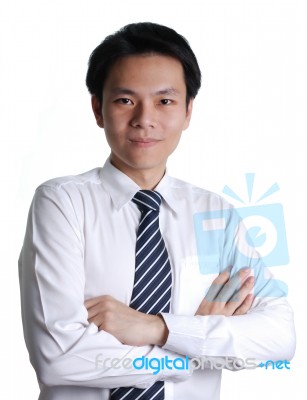 Young Businessman Crossing Arms Stock Photo