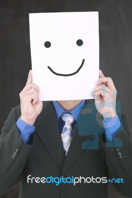 Young Businessman Hiding His Face With A White Billboard With A Stock Photo
