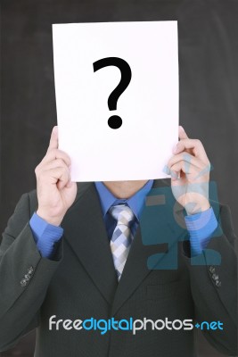 Young Businessman Holding A White Billboard With A Question Mark… Stock Photo