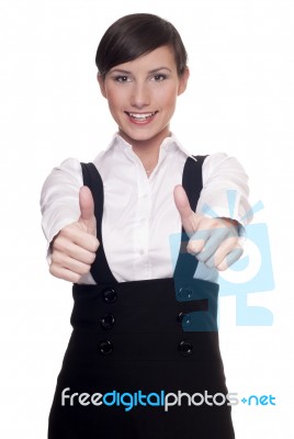 Young Businesswoman Showing Thumbs Up Gesture Stock Photo