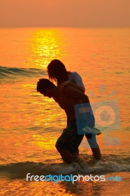 Young Couple At Sunset  Stock Photo