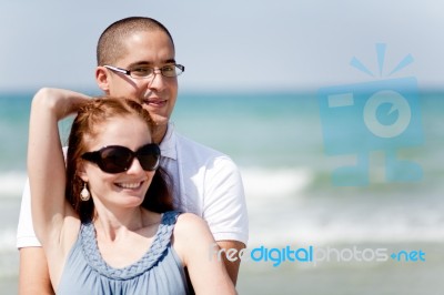 Young Couple At The Beach Stock Photo