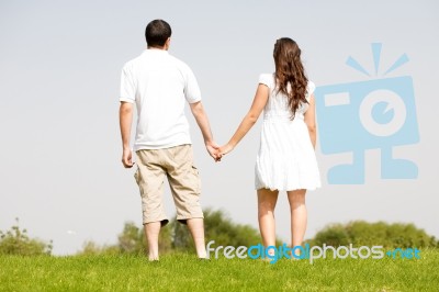 Young Couple Holding Hands Stock Photo