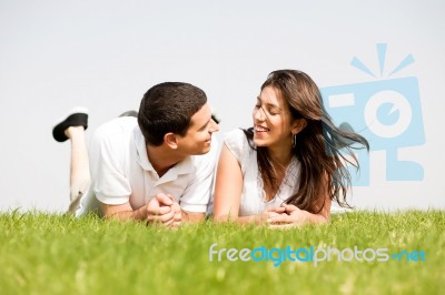 Young Couple Laying Down Stock Photo