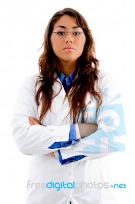 Young Female Doctor With Folded Hands Stock Photo