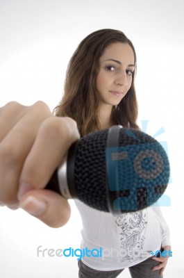 Young Female Holding Microphone Stock Photo
