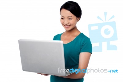 Young Girl Working On Laptop Stock Photo