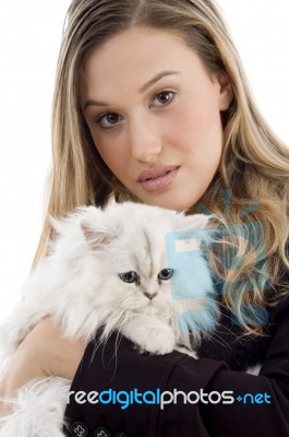 Young Lady Carrying Kitten Stock Photo