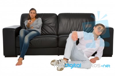 Young lady holding remote control Stock Photo