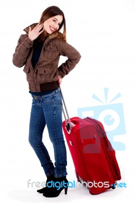 Young Lady Posing With Luggage Stock Photo
