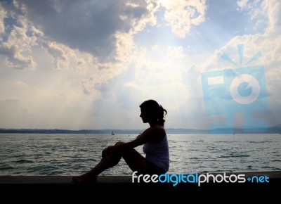Young Lady Relaxing At Beach Stock Photo