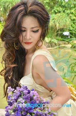 Young Lady With Flowers Stock Photo