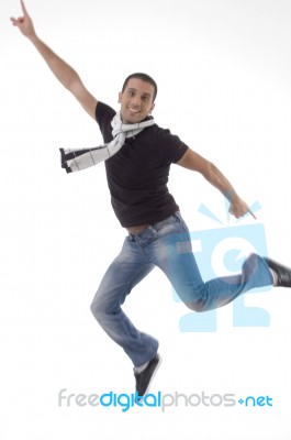 Young Male Leaps In Air Stock Photo