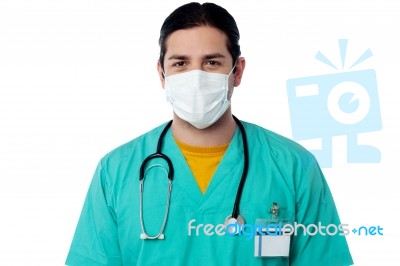 Young Male Surgeon Wearing A Face Mask Stock Photo