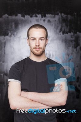 Young Male With Crossed Arms Stock Photo