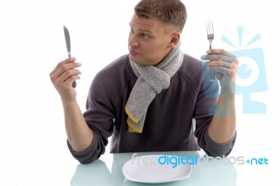 Young Man Looking The Fork Stock Photo