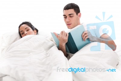Young Man Reading Book Stock Photo