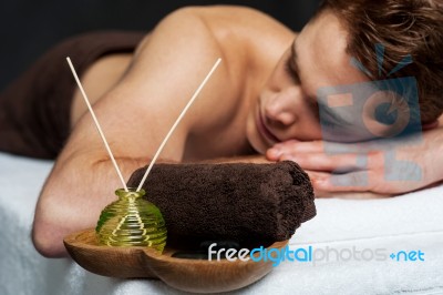 Young Man Relaxing On Massage Table Stock Photo