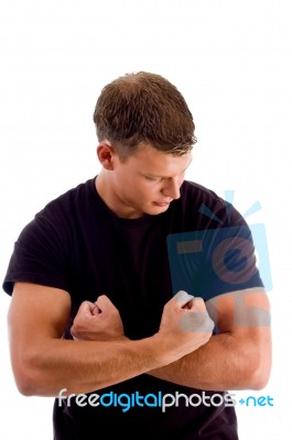 Young Man Showing His Muscles Stock Photo