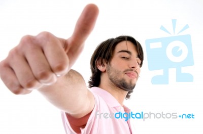 Young Man Showing Thumb Up Stock Photo