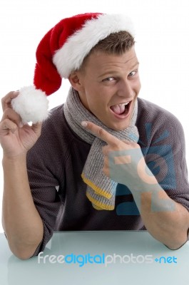 Young Man Wearing Santa Hat Stock Photo