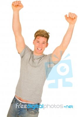 Young Man With Arms Up Stock Photo