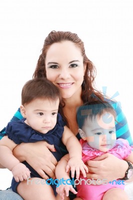 Young Mother With Two Babies Stock Photo