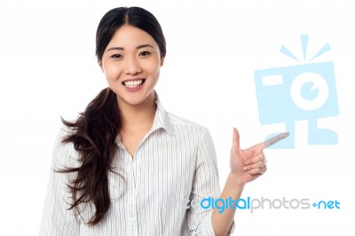 Young Pretty Model Pointing Away Stock Photo